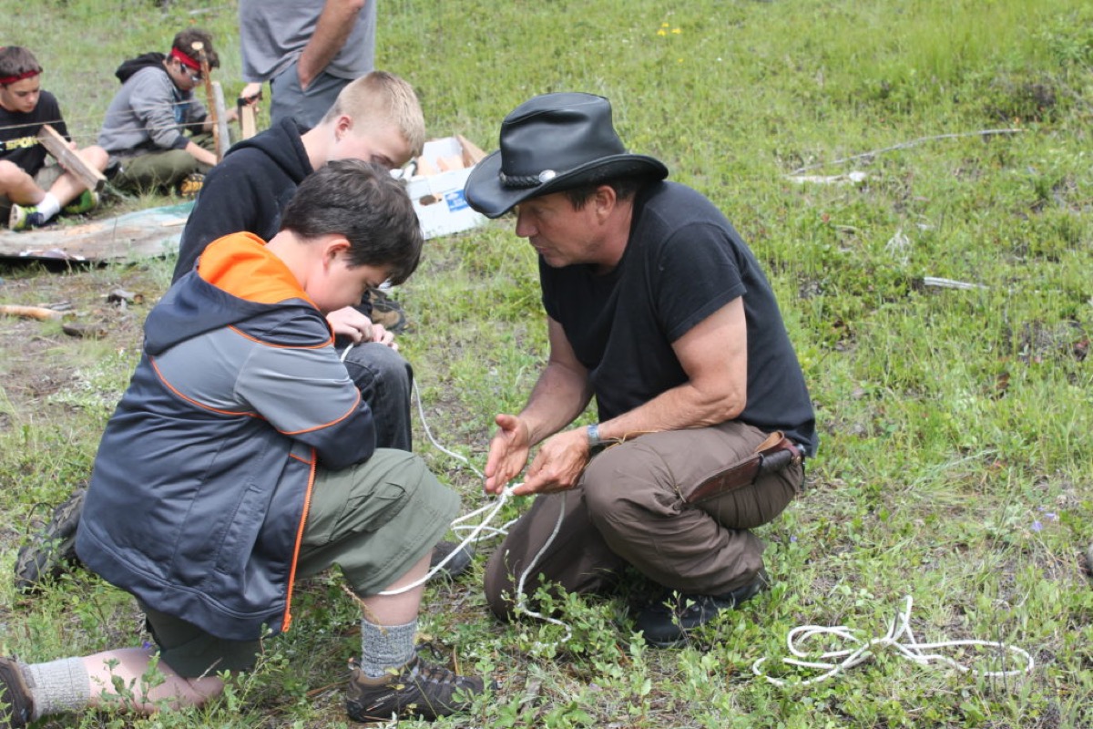 Terry L. Fossum teaching Scouts outdoor skills in the field