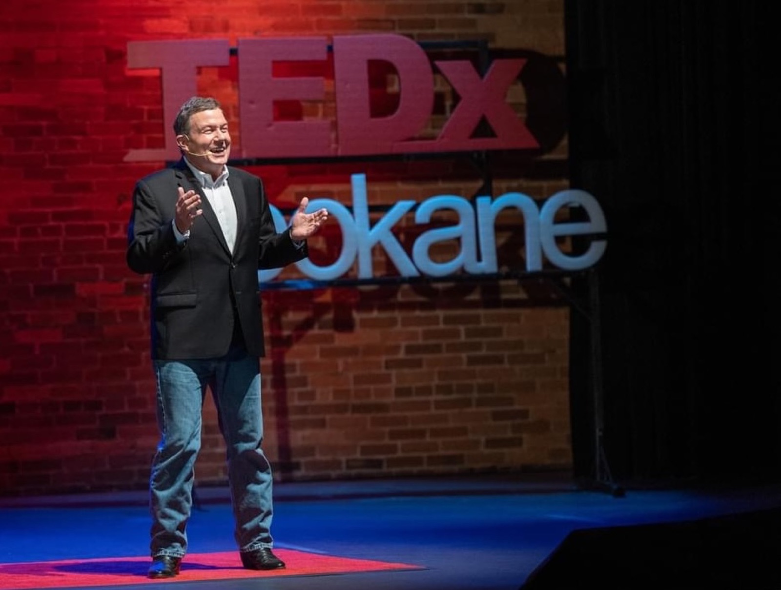 Terry L. Fossum delivering his TEDx talk on the TEDxSpokane stage